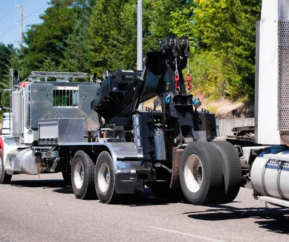 heavy-duty rotator wrecker on a regional highway